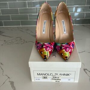 Women’s multi color floral high heel shoes by Manolo Blahnik. Slightly worn.